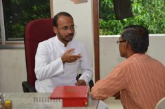 Fr. Agi meets with a parishioner