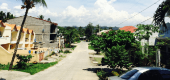 Fr. Tom writes: This street is not too far from our formation house in Cagayan de Oro and I often would walk it during my daily walks. I decided to take this picture for two reasons: (1) It shows the morning build up of clouds that often led to our afternoon thunderstorms. (2) It gives some idea of modern Philippine housing. Housing is one difference I noticed from my first trip in 1990. Both roads and housing have shown marked improvement over that time span. However, do keep in mind Cagayan del Oro is a large city and out in rural areas things can be much simpler. I should also note that I could just as easily turned this camera in the opposite direction and shown shacks constructed of wood, metal and bamboo, or what I take to be bamboo. The same is true in Manila (or any other large city) along with nice housing, mansions even, not all that far away are clusters of slums and shacks. Poverty while less then what I saw in 1990 is still a reality for far too many.