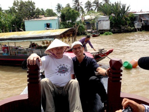 Fr. Wayne and Trung on the Mekong Riover