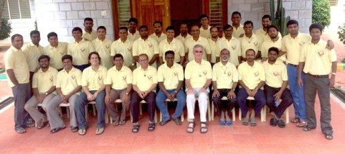 Group photo of chapter delegates. Fr. Tom is in the front row wearing white pants.