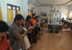 Teachers at Yos Sudarso pray at the start of the school day