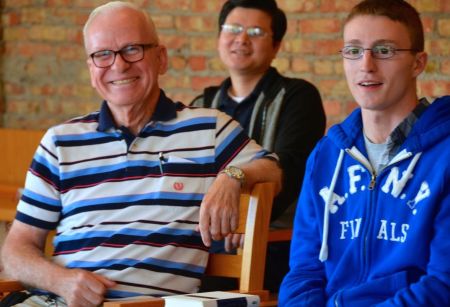 Fr. John (left) smiling during  a community meeting with the Dehon Formation Community in Chicago last fall. The retired novice master has served in formation during most of his 51 years of priesthood. 