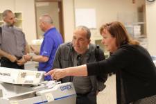 Fr. Jesús with a St. Joe's staffer