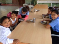 Children getting a meal at a soup kitchen
