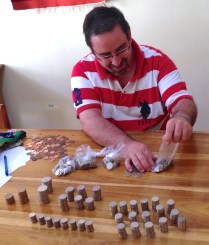 Fr. Jonathan counts the weekend collection