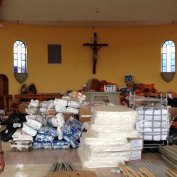 Mattresses and other relief supplies fill the church